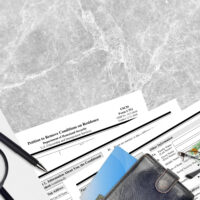 USCIS form I-751 Petition to remove conditions on residence lies on flat lay office table and ready to fill. U.S. Citizenship and Immigration services paperwork concept. Top view