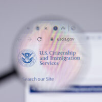 USCIS United States Citizenship and Immigration Services logo close-up on website page