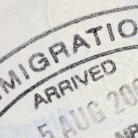 Passport immigration stamp on the inside page of a passport