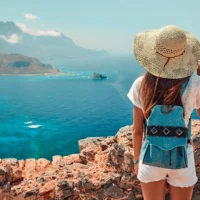 Tourism, travel, vacation on the rocky sea.