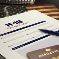 h1b-visa-application-form-on-a-table-with-a-pen