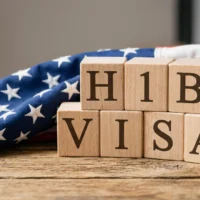 wooden-blocks-with-h1b-visa-text-on-american-flag